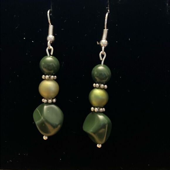 Handcrafted silver tone earrings with green beading. - Picture 1 of 3